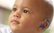 infant with hearing aids